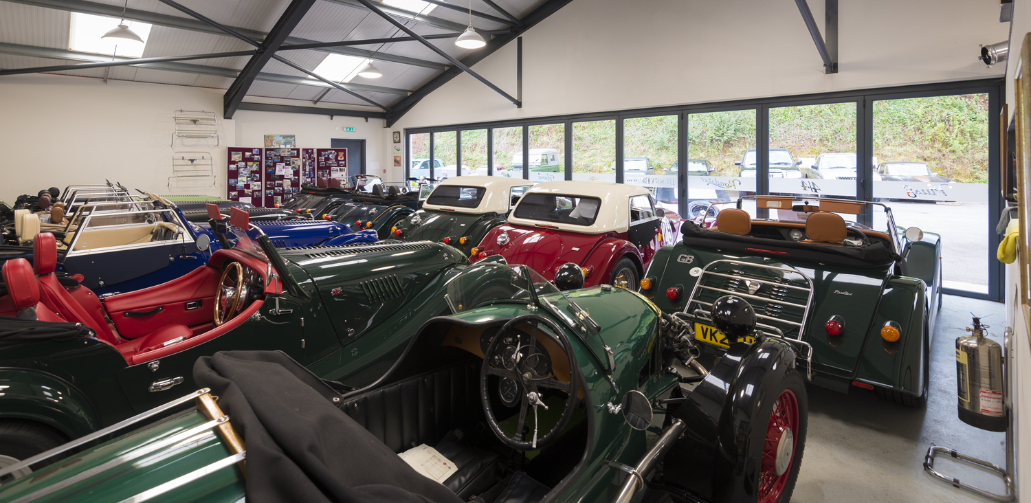 Inside of a car showroom looking out through closed Origin bifold doors