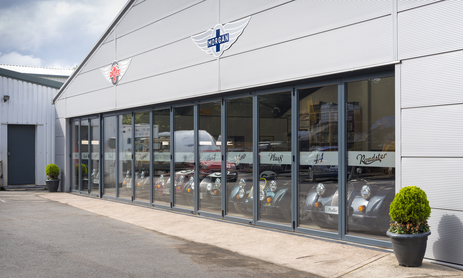 Bifold doors at the front of a car showroom