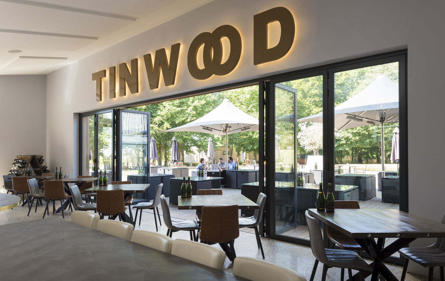 Open bifolds from the inside of a bar leading out into a beer garden