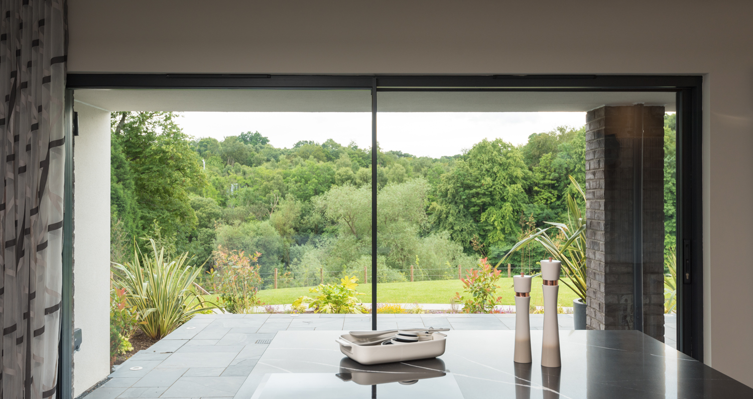 Origin sliding door looking out into a garden from the kitchen