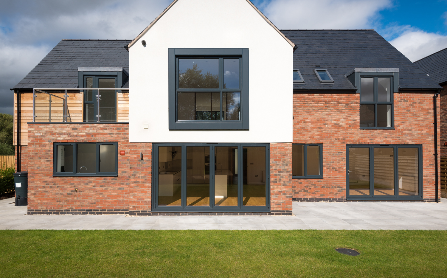 Wide view of the back of a modern house fitting with Origin products