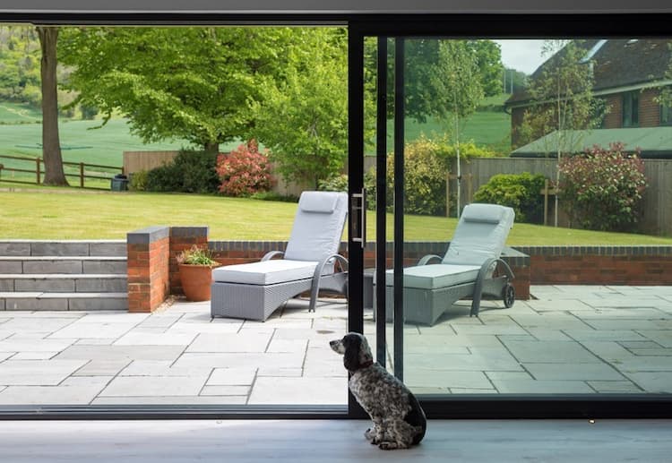 Origin sliding doors with a view over a large garden