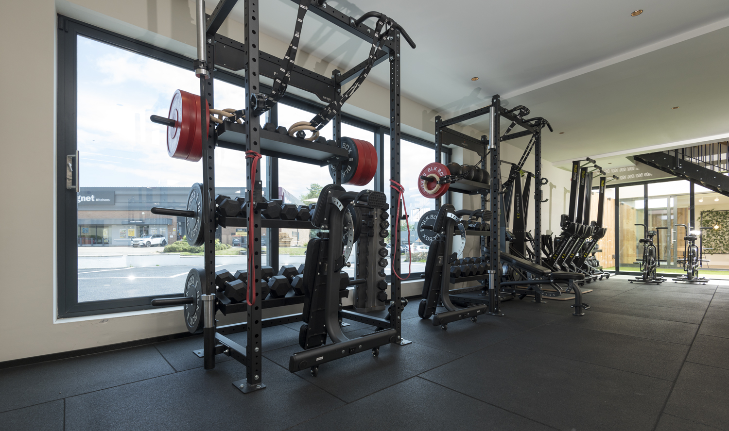 Two sets of workout racks looking through Origin windows