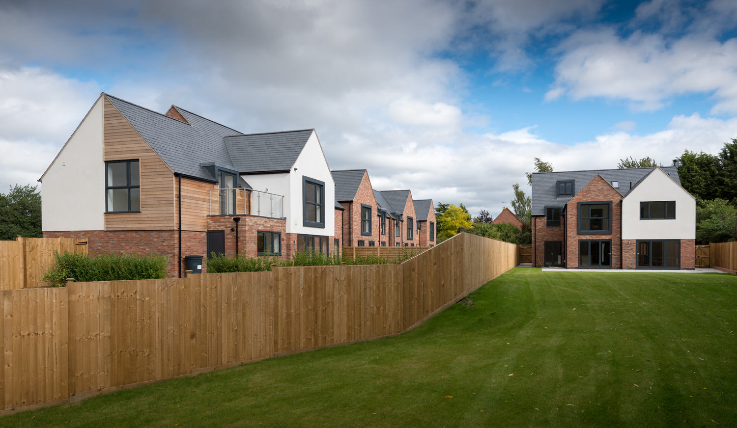 Scenic view of a row of modern houses from the garden