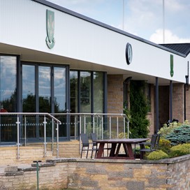 Wide view of a golf club fitted with Origin bifold doors