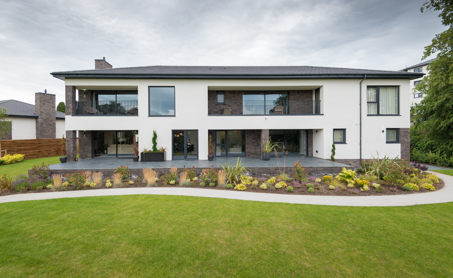 Rear view of a modern house fitted with Origin bifold doors and windows