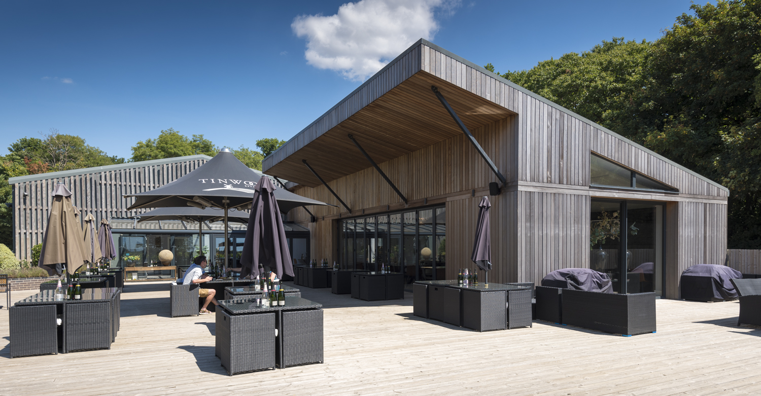 Wide outdoor view of a bar and garden fitted with bifold doors